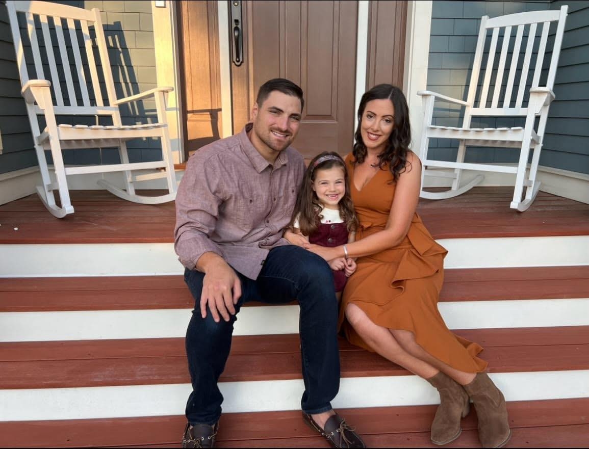 Chad and his family on their porch